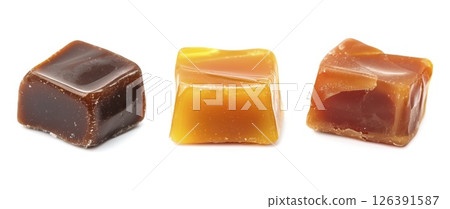 Caramel candies isolated on white background with clipping path Caramel candies isolated on white background with clipping path 126391587