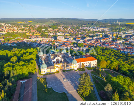Holy Mountain in Pribram is a stunning Baroque pilgrimage site surrounded by lush greenery and offering panoramic views of the nearby town and hills. Visitors come for reflection and tranquility. 126391910