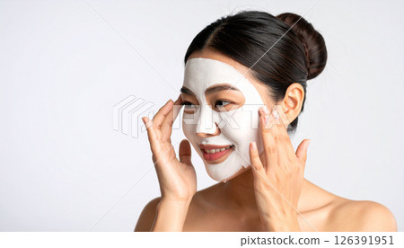 Woman applying face mask (AI generated image) 126391951