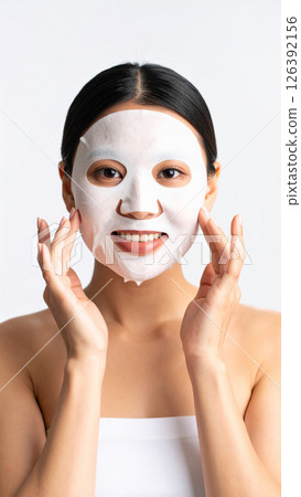 Woman applying face mask (AI generated image) 126392156