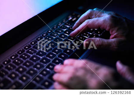 Male hands are typing on a laptop keyboard. Male hands are typing on a laptop keyboard. 126392168