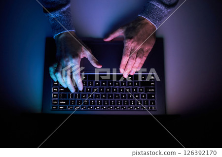 Male hands are typing on a laptop keyboard. Male hands are typing on a laptop keyboard. 126392170