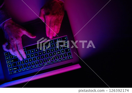 Male hands are typing on a laptop keyboard. Male hands are typing on a laptop keyboard. 126392174