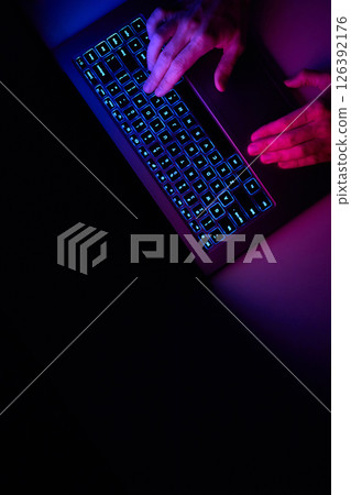 Male hands are typing on a laptop keyboard. Male hands are typing on a laptop keyboard. 126392176