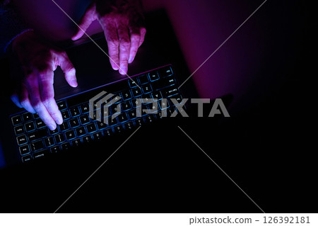 Male hands are typing on a laptop keyboard. Male hands are typing on a laptop keyboard. 126392181