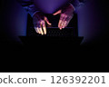 Male hands are typing on a laptop keyboard. 126392201