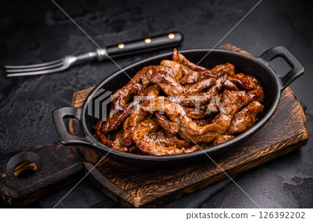 Korean Beef Meat Bulgogi Hot Plate. black background. top view 126392202