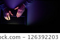 Male hands are typing on a laptop keyboard. 126392203