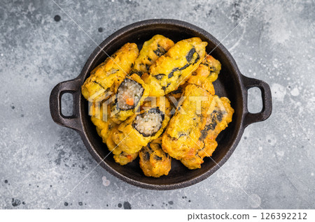 Korean Crispy seaweed noodle rolls Gimmari deep-fried seaweed rice rolls. grey background. top view Korean Crispy seaweed noodle rolls Gimmari deep-fried seaweed rice rolls. grey background. top view 126392212