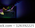 Male hands are using calculator on mobile phone and laptop keyboard. 126392225