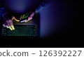 Male hands are using calculator on mobile phone and laptop keyboard. 126392227