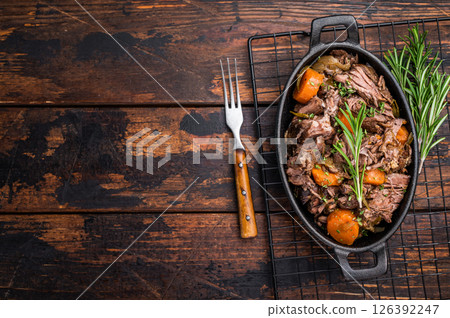 Skillet of beef bourguignon with tender beef, carrots, and mushrooms. wooden background. top view 126392247