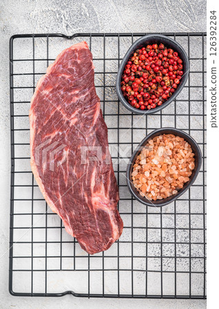 Fresh raw top sirloin steak, showcasing its rich color and marbling. grey background. top view 126392284