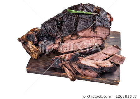 Slow ccoked sliced Venison leg, roasted game meat of deer on a board with herbs isolated on white background. top view 126392513