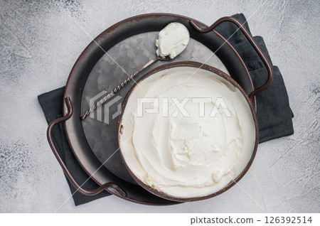 Mascarpone Italian cream cheese in wooden bowl. white background. top view 126392514