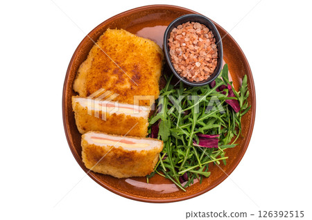 Chicken Fried cordon bleu cutlet on plate with salad isolated on white background. top view 126392515