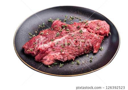 Raw hanger tender beef steak, skirt steak on plate with herbs and spices isolated on white background. top view Raw hanger tender beef steak, skirt steak on plate with herbs and spices isolated on white background. top view 126392523