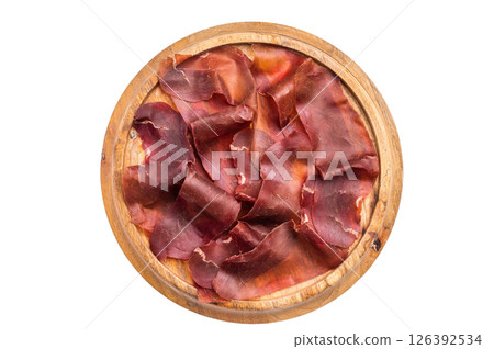 Cecina meat slices, spanish beef jamon on wooden tray isolated on white background. top view Cecina meat slices, spanish beef jamon on wooden tray isolated on white background. top view 126392534