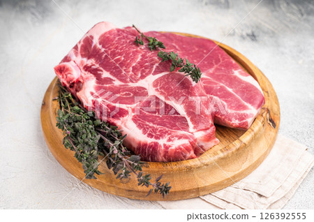 Raw pork tender neck steak, fresh meat. grey background. top view 126392555