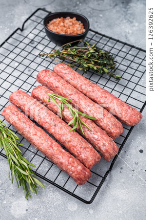 Raw beef and lamb meat kebabs sausages, kofta kebab. grey background. top view 126392625