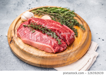 Raw beef marbled steak, Australian Oyster Top blade steak. grey background. top view 126392639