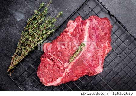 Raw hanging tender or onglet beef steak. black background. top view 126392689