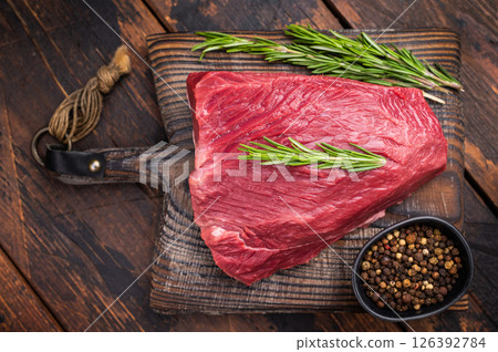 Butcher cutting board with Raw Wild Boar meat, fresh Game Meat. wooden background. top view 126392784
