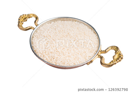 Uncooked white Rice in a bowl isolated on white background. top view Uncooked white Rice in a bowl isolated on white background. top view 126392798