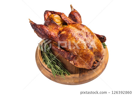Baked whole duck with apples on wooden board isolated on white background. top view 126392860