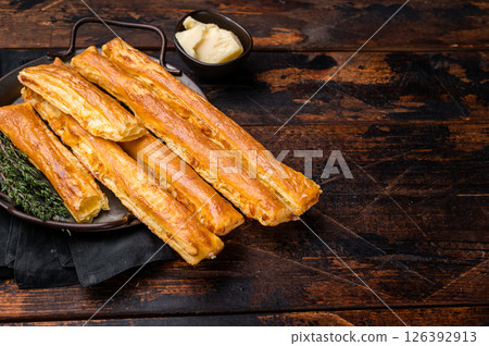 Homemade pastry, Bread sticks with cheese and salt. wooden background. top view 126392913