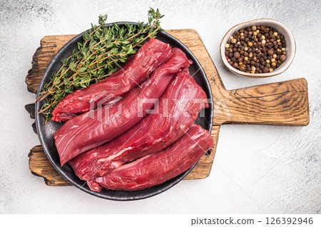 Fresh lamb tenderloin fillet meat, raw loin mutton. white background. top view 126392946