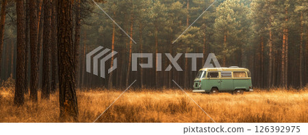 Vintage Camper Van Parked in a Serene Forest Setting 126392975