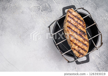 Delicious kofta kebabs sizzling on the grill, infused with aromatic spices for a mouthwatering culinary experience.. white background. top view Delicious kofta kebabs sizzling on the grill, infused with aromatic spices for a mouthwatering culinary experience.. white background. top view 126393019