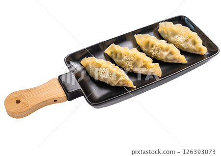 Steamed Chinese Jiaozi Dumplings with pork meat and vegetables isolated on white background. top view Steamed Chinese Jiaozi Dumplings with pork meat and vegetables isolated on white background. top view 126393073