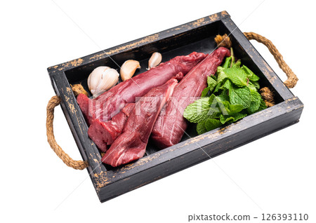 Mutton tenderloin fillet meat, raw lamb in wooden tray with herbs isolated on white background. top view Mutton tenderloin fillet meat, raw lamb in wooden tray with herbs isolated on white background. top view 126393110