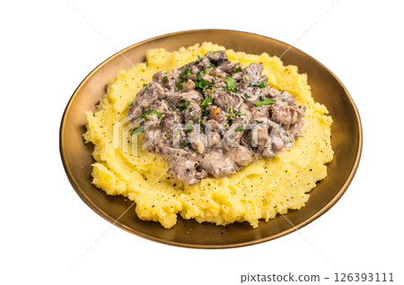Beef Stroganoff over mashed potatoes with creamy sauce in a plate isolated on white background. top view Beef Stroganoff over mashed potatoes with creamy sauce in a plate isolated on white background. top view 126393111