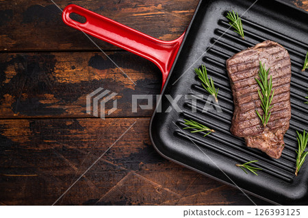 Grilled beef Top sirloin steak or Rump steak in grill pan. wooden background. top view Grilled beef Top sirloin steak or Rump steak in grill pan. wooden background. top view 126393125