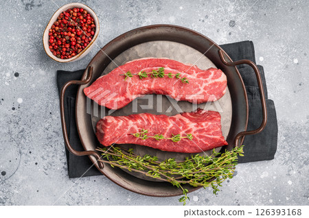 Raw Tri Tip Steak from Black Angus beef meat in stell tray. grey background. top view 126393168