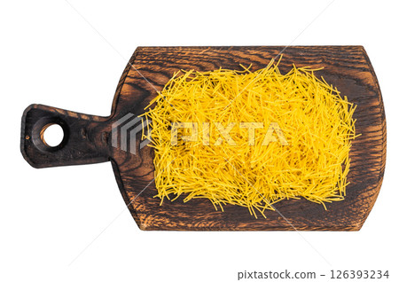 Vermicelli pasta, Raw uncooked on a wooden board isolated on white background. top view 126393234