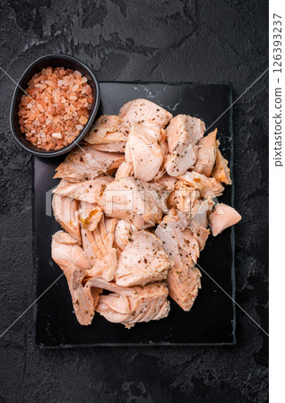 Shredded salmon, roasted fillets on a marble board. black background. Top view 126393237