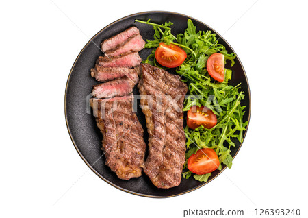 Grilled Steak from Black Angus beef meat on a plate with salad isolated on white background 126393240