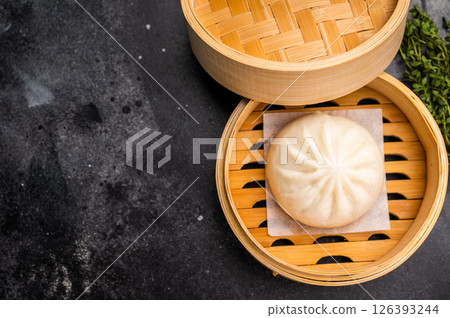 Momo with meat in bamboo steamer. black background. top view 126393244