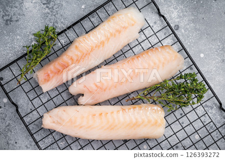 Fresh raw cod fish fillet, Boneless white fish meat. gray background. top view 126393272