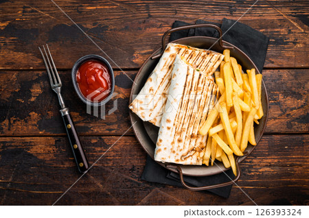 Doner kebab, Shawarma with meat, salad and french fry. wooden background. top view 126393324