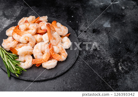A plate of shrimp with a sprig of rosemary on top. The shrimp are arranged in a way that they are not overlapping each other. A plate of shrimp with a sprig of rosemary on top. The shrimp are arranged in a way that they are not overlapping each other. 126393342