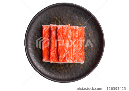 Crab meat stick on plate isolated on the white background. top view 126393423