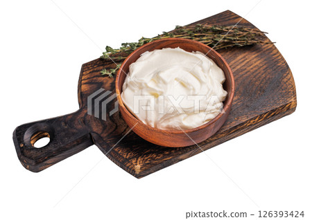 Dip sauce with Fresh Sour cream in a bowl isoalted on white background. top view Dip sauce with Fresh Sour cream in a bowl isoalted on white background. top view 126393424