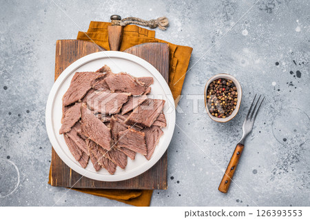 Corned sliced beef meat in a plate. gray background. top view Corned sliced beef meat in a plate. gray background. top view 126393553