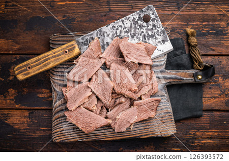 Corned sliced beef meat on wooden cutting board. wooden background. top view 126393572