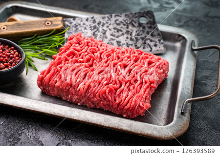 Uncooked Raw beef mince meat, forcemeat, in kitchen tray ready for cooking. Uncooked Raw beef mince meat, forcemeat, in kitchen tray ready for cooking. 126393589